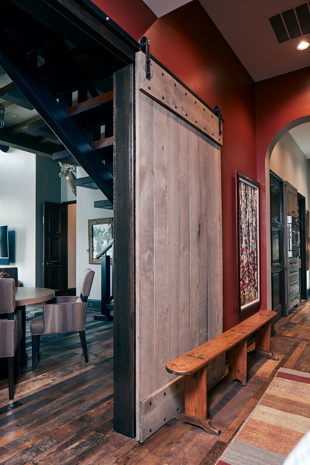 rustic hallway with barn door opening