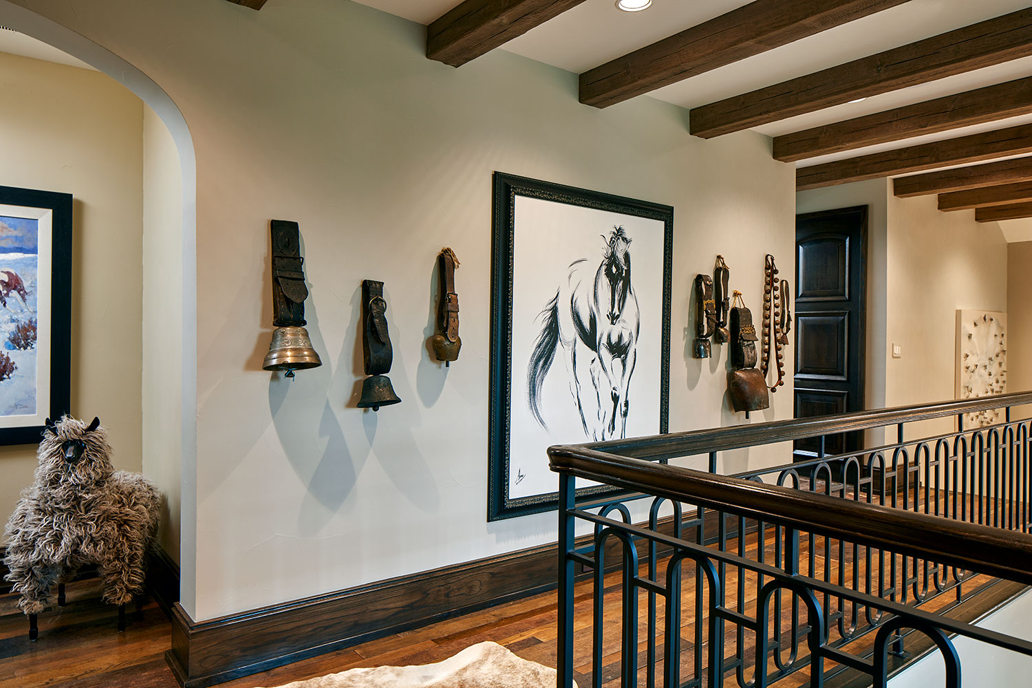 Upper Hallway with Wood Beam Ceiling, Cow Bell Collection