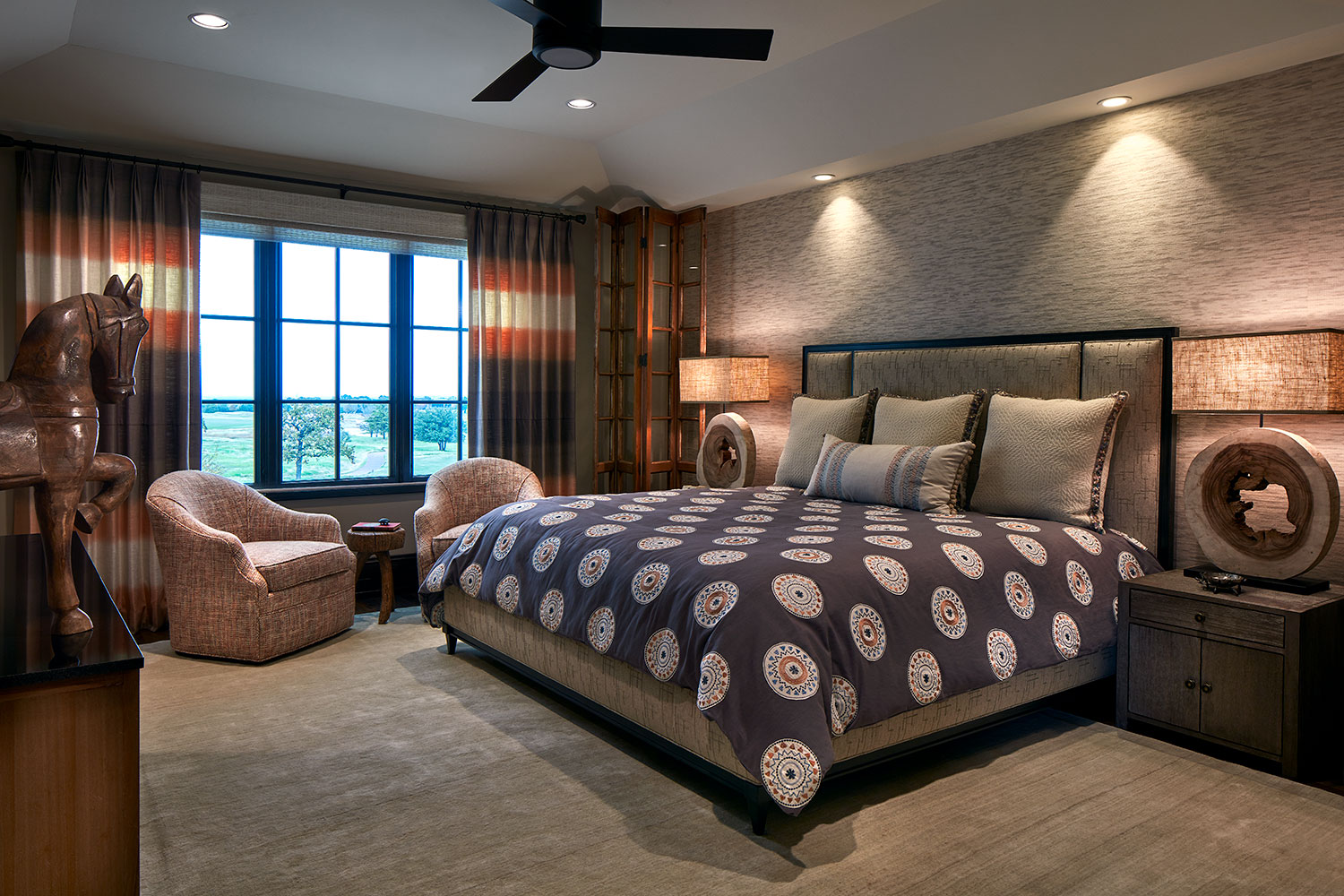 Brown and Taupe Bedroom with Swivel Lounge Chairs and Color-Block Window Panels