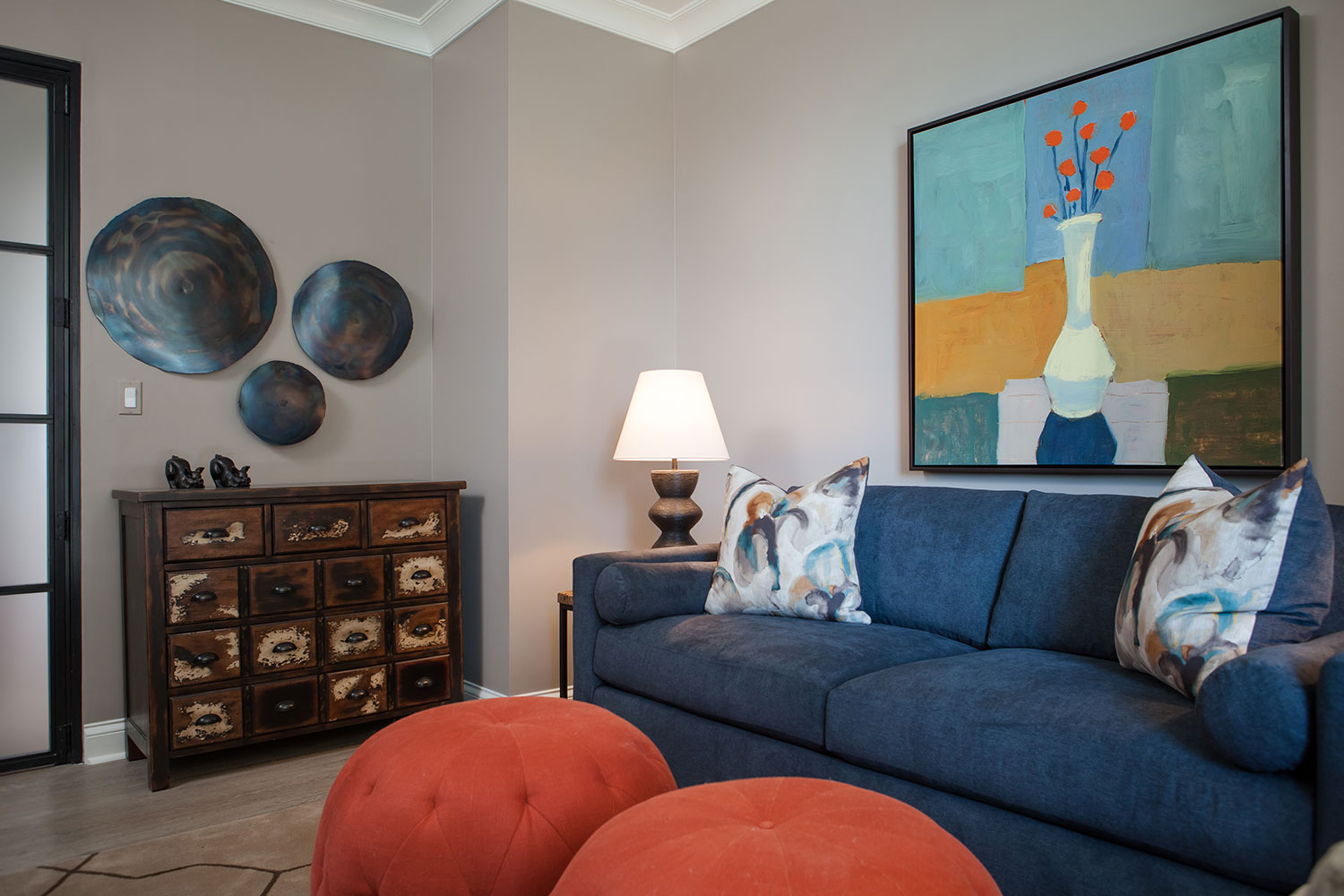 Tufted Orange Poufs in Family Room