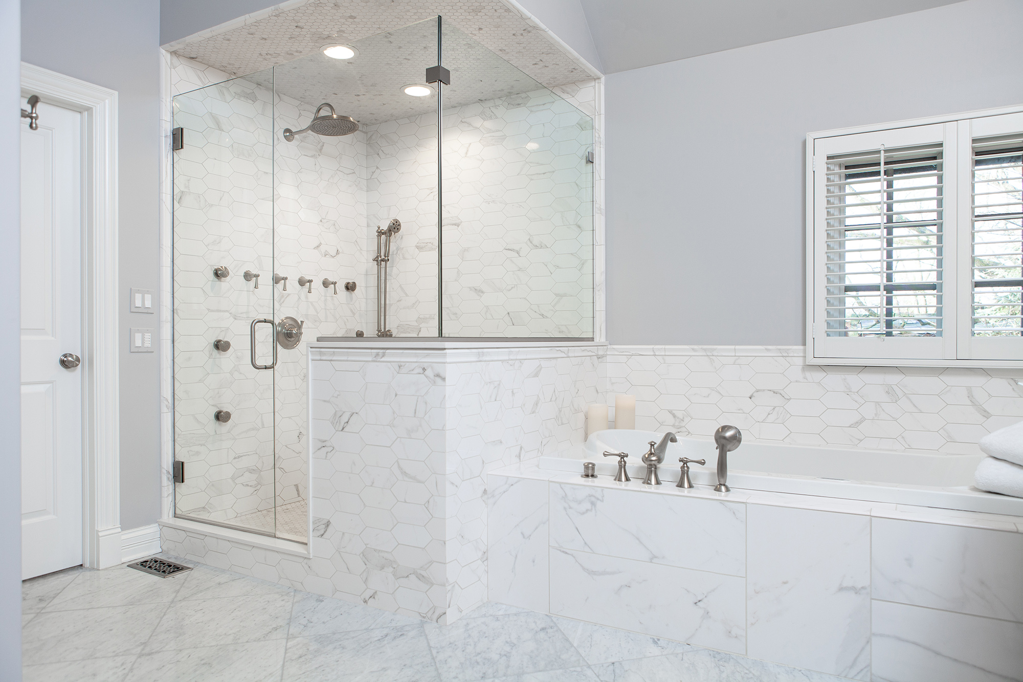 white marble tub and shower