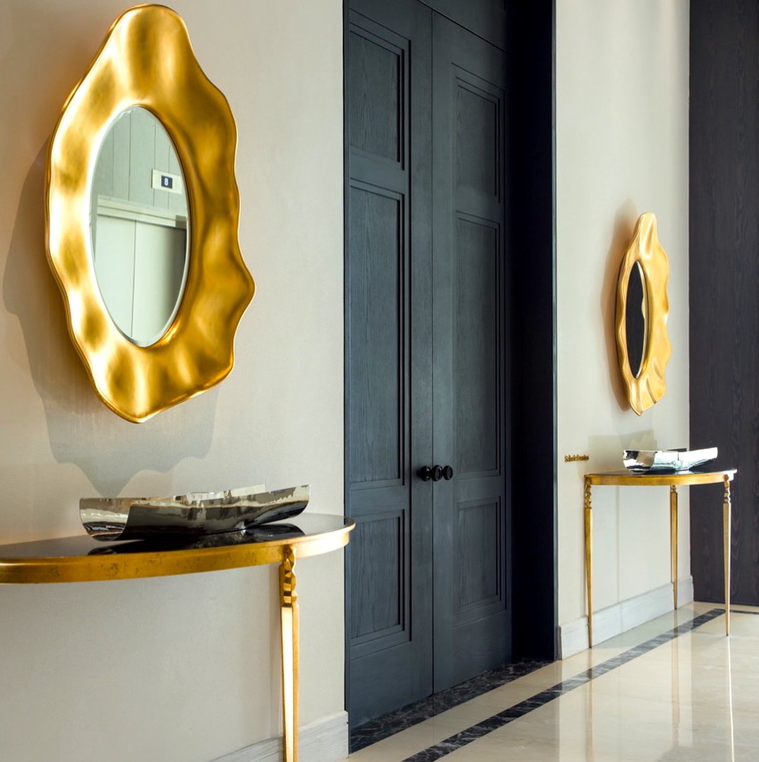 pair of christopher guy mirrors in entry hall