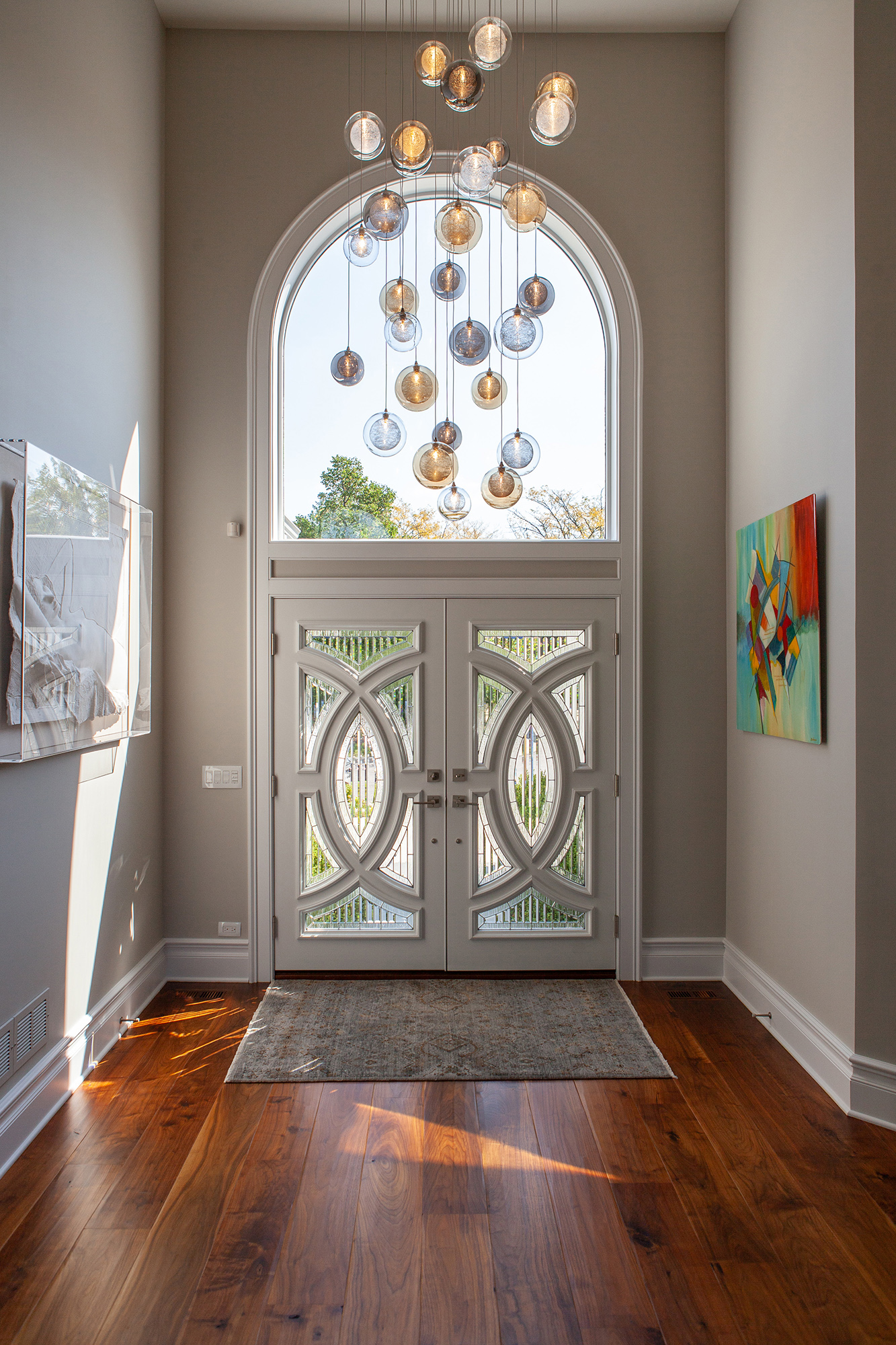 multi color glass chandelier in front entry