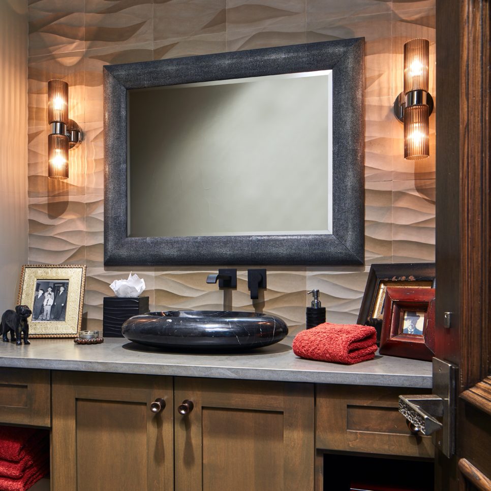 Masculine Bathroom with Black Vessel Sink and TV in Mirror