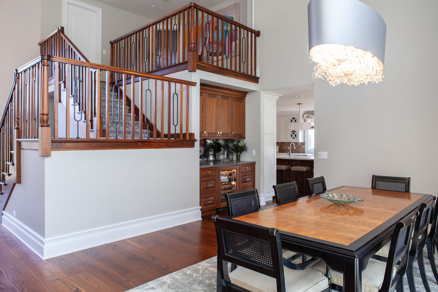 dining room with open staircase in background