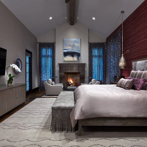 master bedroom with fireplace and designer bed