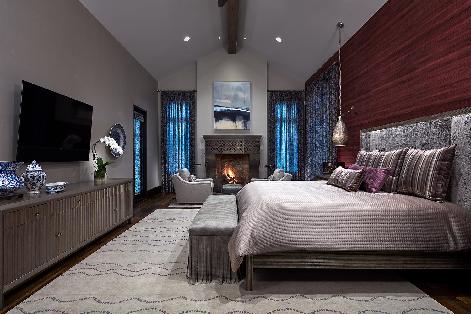 master bedroom with fireplace and designer bed