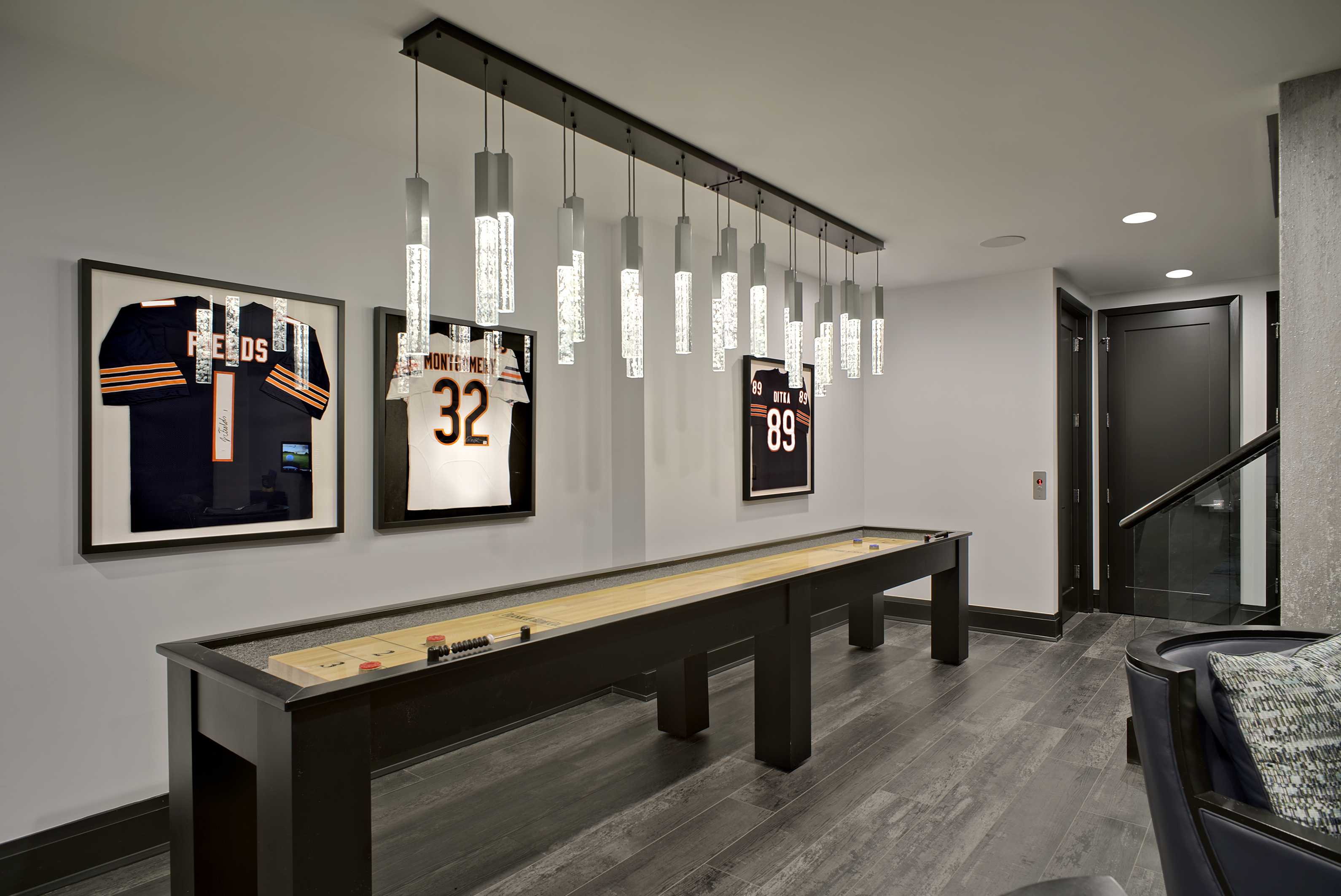 large shuffle board with glass pendant lighting