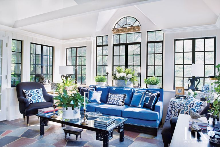 sunroom-black-windows-blue-sofa-luxe-magazine