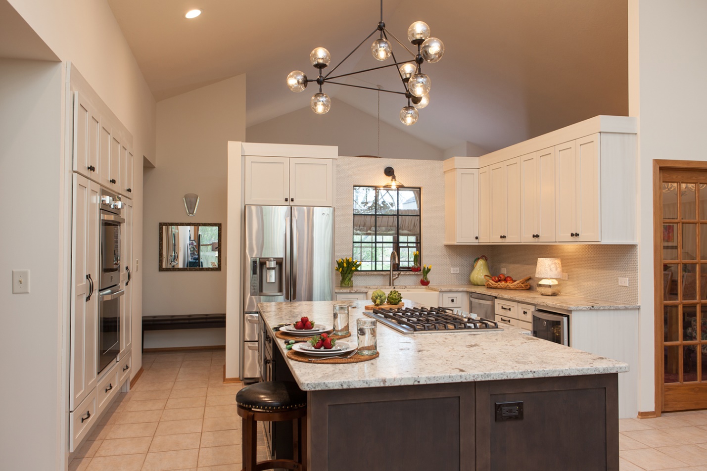 white floating kitchen with dark island